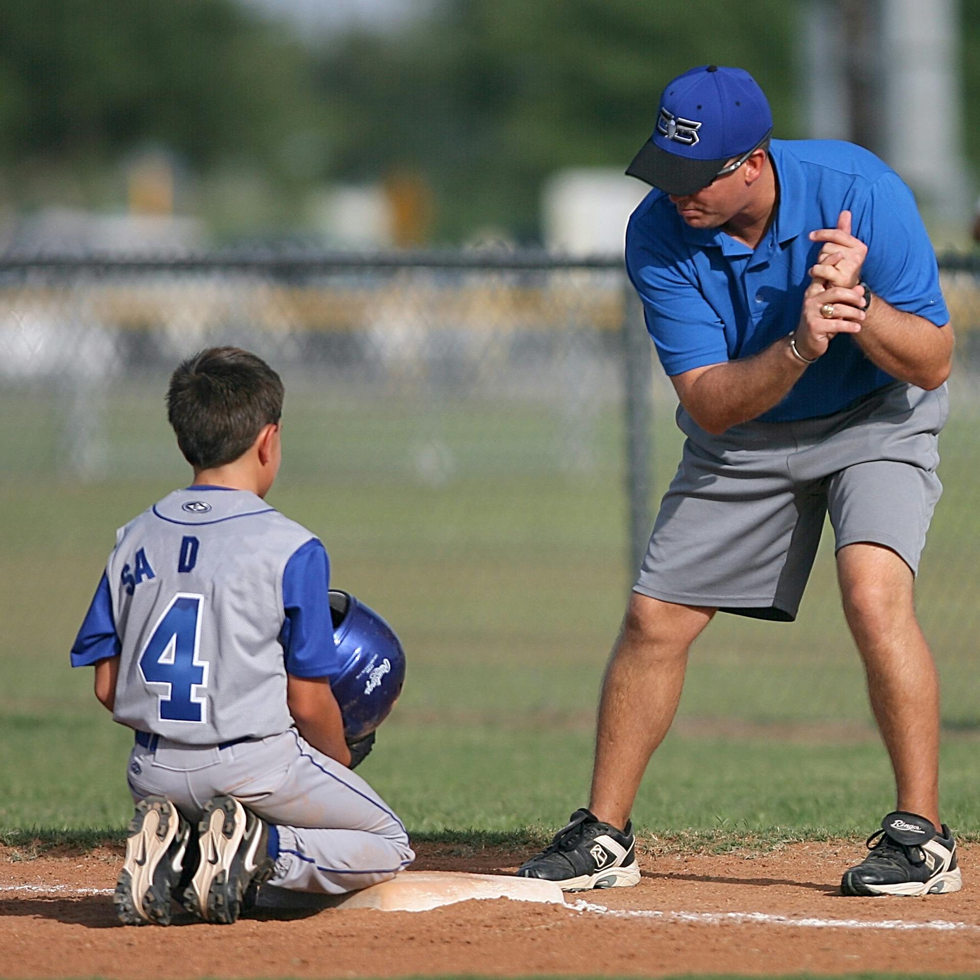 Coach instructing athletes during training session